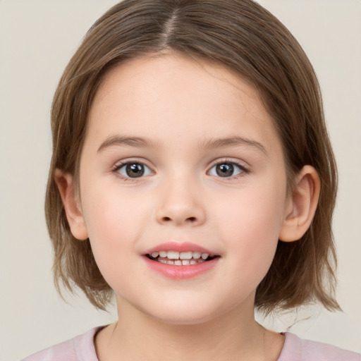 Joyful white child female with medium  brown hair and brown eyes