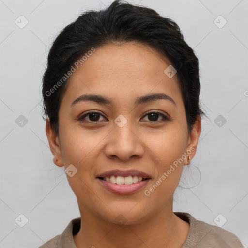 Joyful latino young-adult female with short  brown hair and brown eyes