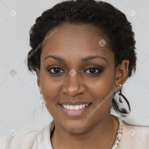 Joyful black young-adult female with short  black hair and brown eyes