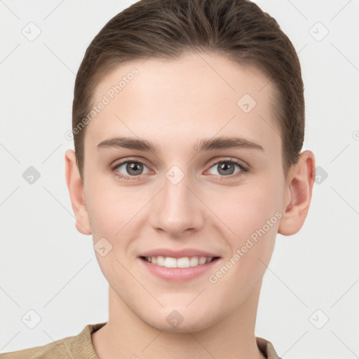 Joyful white young-adult female with short  brown hair and grey eyes