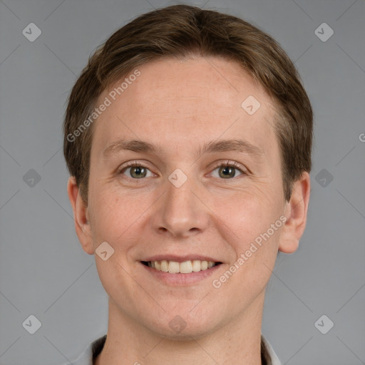 Joyful white adult male with short  brown hair and grey eyes