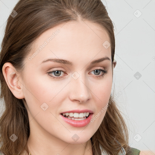 Joyful white young-adult female with long  brown hair and blue eyes