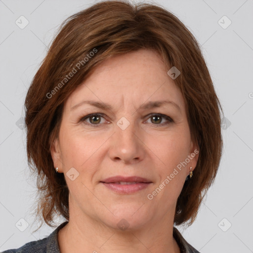 Joyful white adult female with medium  brown hair and grey eyes