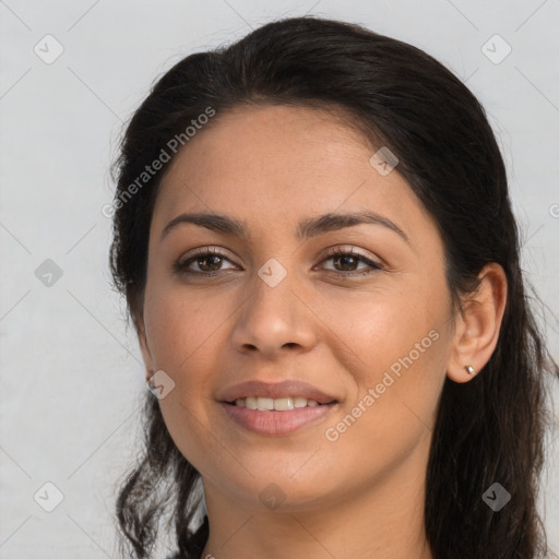 Joyful latino young-adult female with long  brown hair and brown eyes