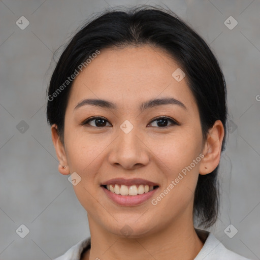 Joyful asian young-adult female with medium  brown hair and brown eyes