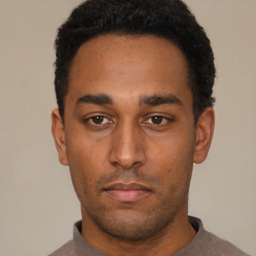 Neutral black young-adult male with short  black hair and brown eyes