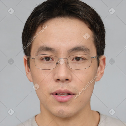 Neutral asian young-adult male with short  brown hair and brown eyes