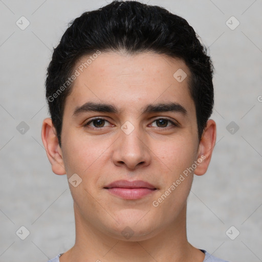 Joyful white young-adult male with short  black hair and brown eyes