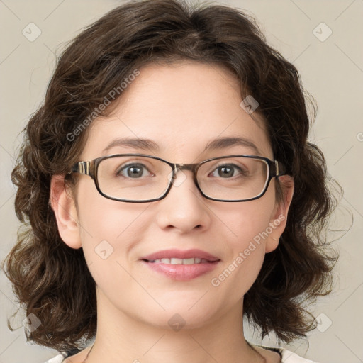 Joyful white young-adult female with medium  brown hair and green eyes