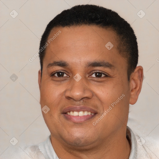 Joyful latino young-adult male with short  brown hair and brown eyes