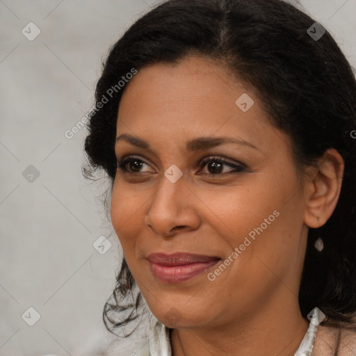 Joyful latino young-adult female with medium  brown hair and brown eyes