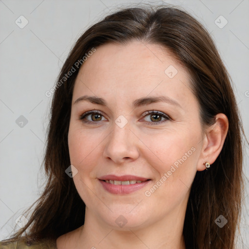 Joyful white adult female with long  brown hair and brown eyes