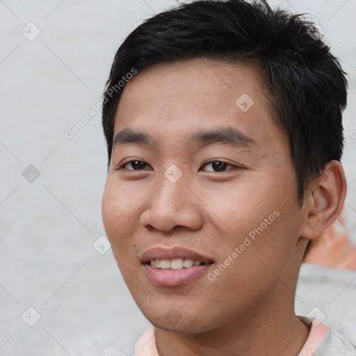 Joyful asian young-adult male with short  brown hair and brown eyes