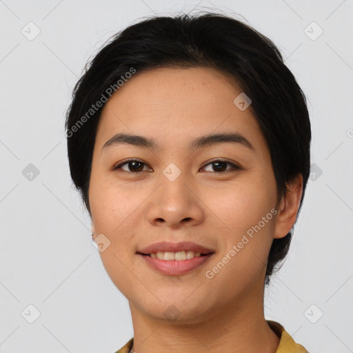 Joyful asian young-adult female with medium  black hair and brown eyes