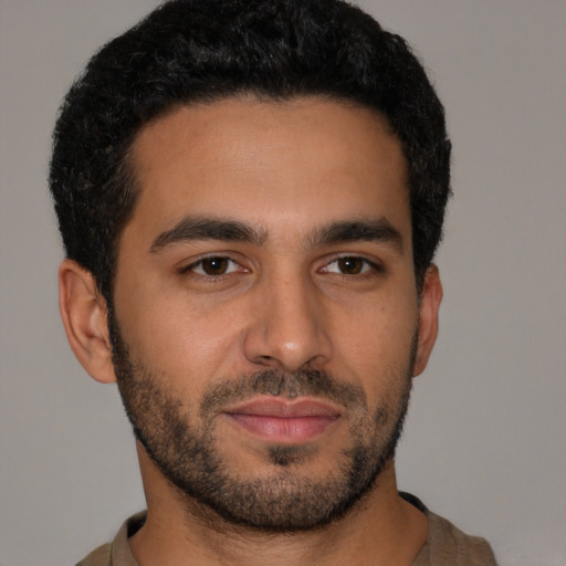 Neutral latino young-adult male with short  black hair and brown eyes