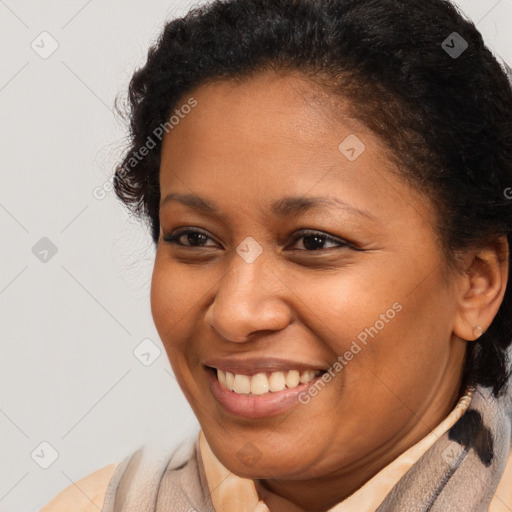 Joyful latino young-adult female with short  brown hair and brown eyes