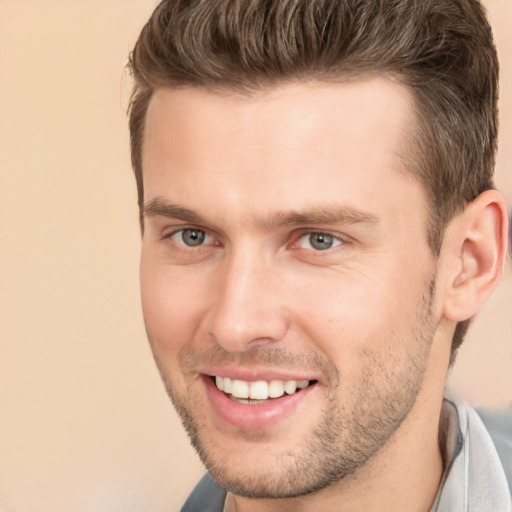 Joyful white young-adult male with short  brown hair and brown eyes