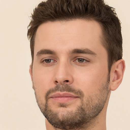 Joyful white young-adult male with short  brown hair and brown eyes