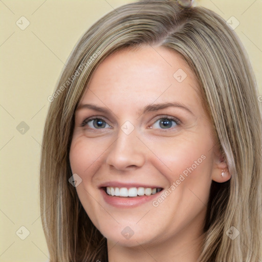 Joyful white young-adult female with long  brown hair and grey eyes