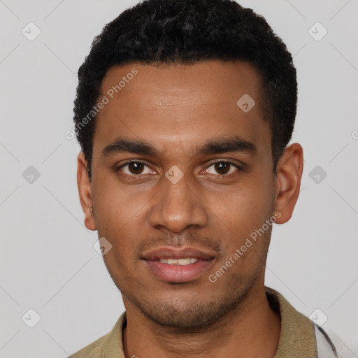 Joyful black young-adult male with short  black hair and brown eyes