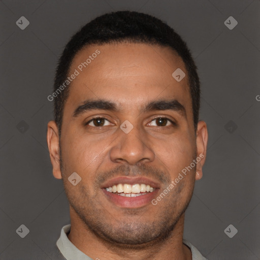 Joyful black young-adult male with short  brown hair and brown eyes