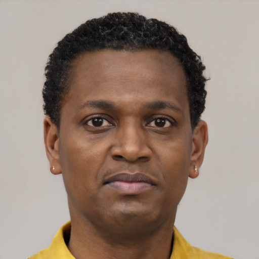 Neutral black young-adult male with short  brown hair and brown eyes