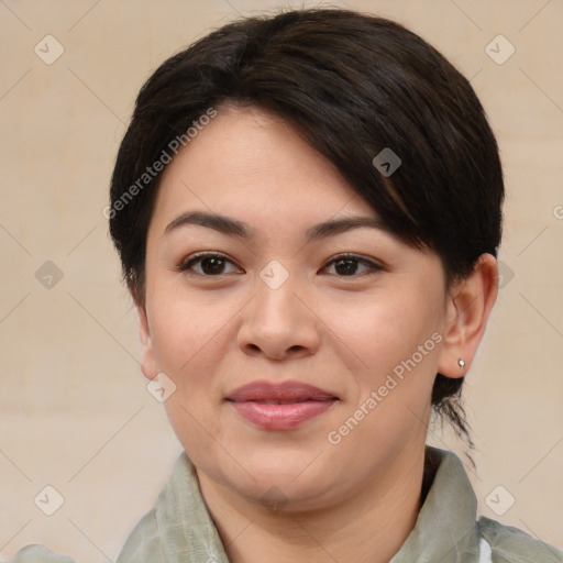 Joyful asian young-adult female with medium  brown hair and brown eyes