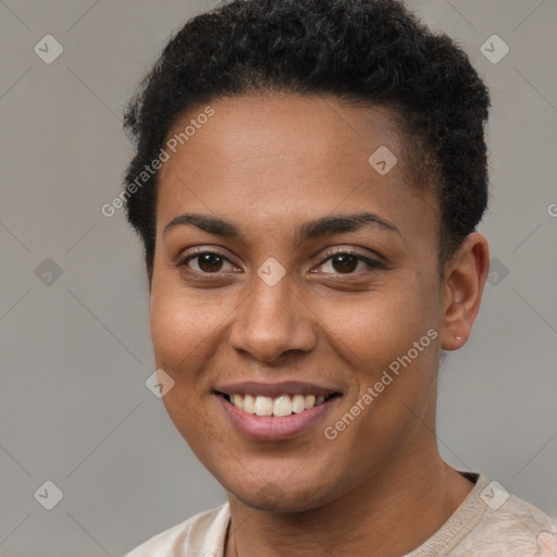 Joyful black young-adult female with short  brown hair and brown eyes