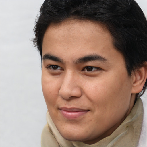 Joyful asian young-adult male with short  brown hair and brown eyes