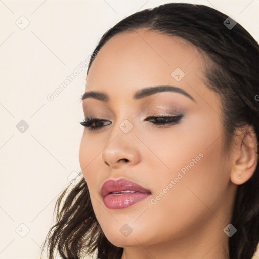 Joyful latino young-adult female with long  black hair and brown eyes