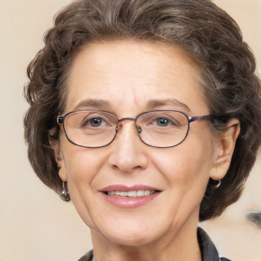 Joyful white middle-aged female with medium  brown hair and brown eyes