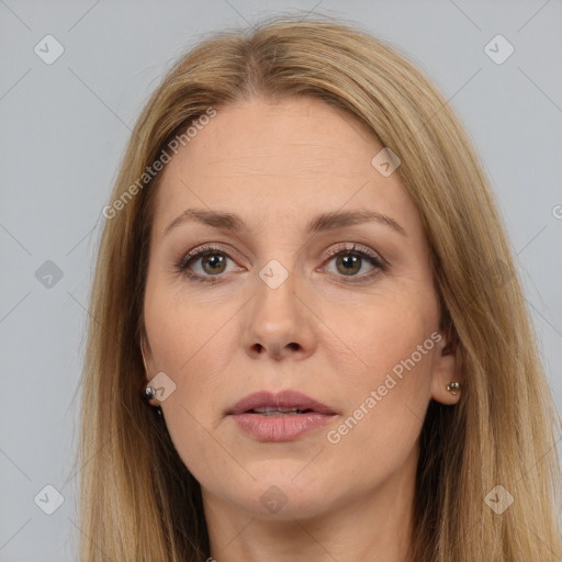 Joyful white adult female with long  brown hair and brown eyes