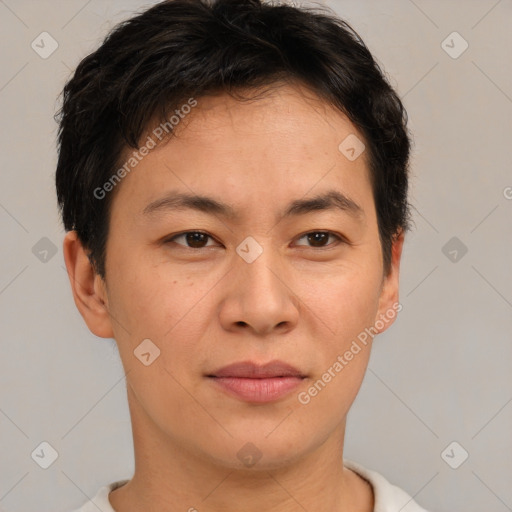 Joyful asian young-adult male with short  brown hair and brown eyes