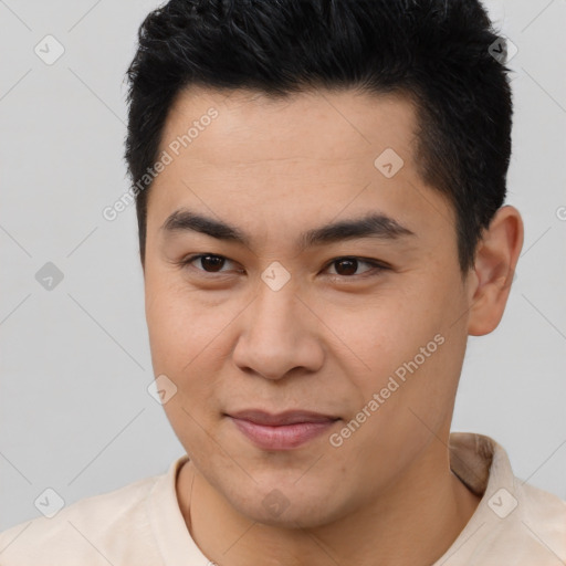 Joyful latino young-adult male with short  brown hair and brown eyes