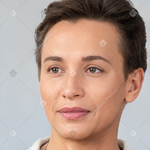 Joyful white young-adult female with short  brown hair and brown eyes