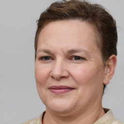 Joyful white adult female with short  brown hair and grey eyes