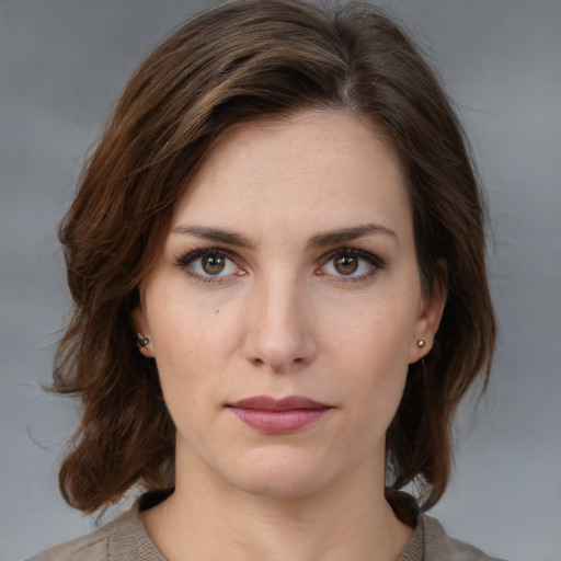 Neutral white young-adult female with medium  brown hair and brown eyes