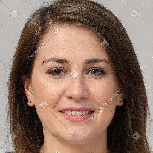 Joyful white young-adult female with long  brown hair and brown eyes