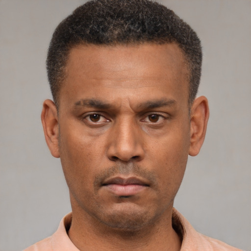 Neutral latino young-adult male with short  brown hair and brown eyes