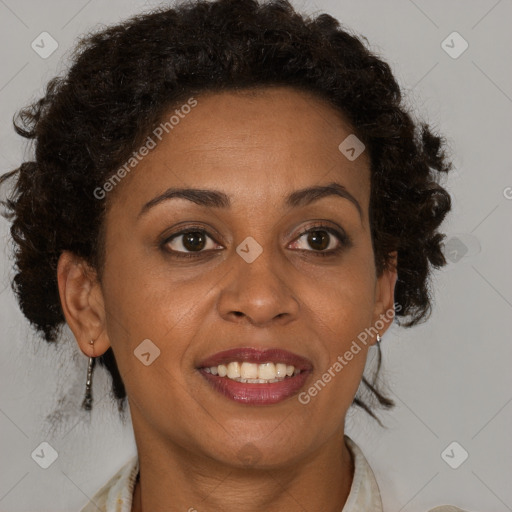 Joyful black adult female with medium  brown hair and brown eyes