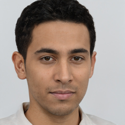 Neutral latino young-adult male with short  brown hair and brown eyes