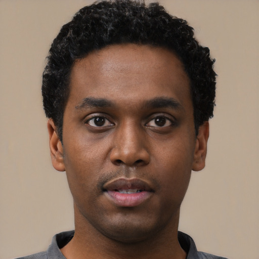 Neutral black young-adult male with short  black hair and brown eyes