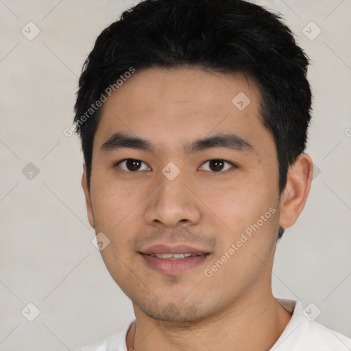 Joyful asian young-adult male with short  black hair and brown eyes