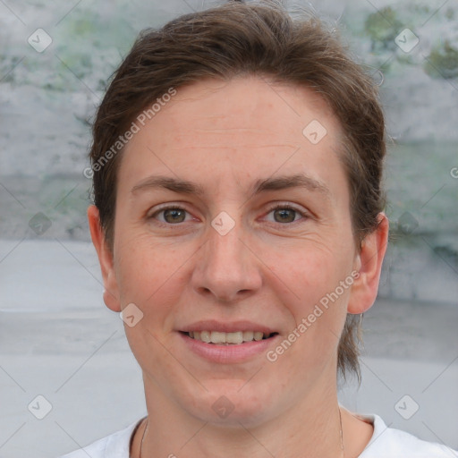 Joyful white adult female with short  brown hair and grey eyes