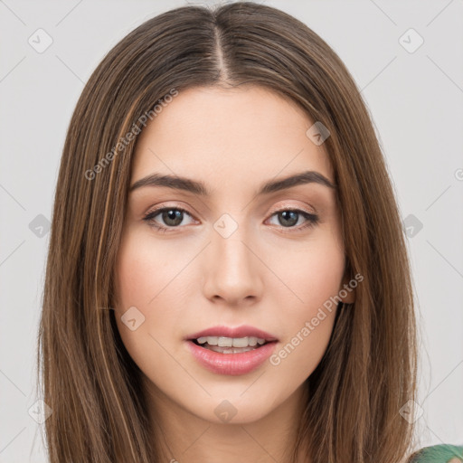 Joyful white young-adult female with long  brown hair and green eyes