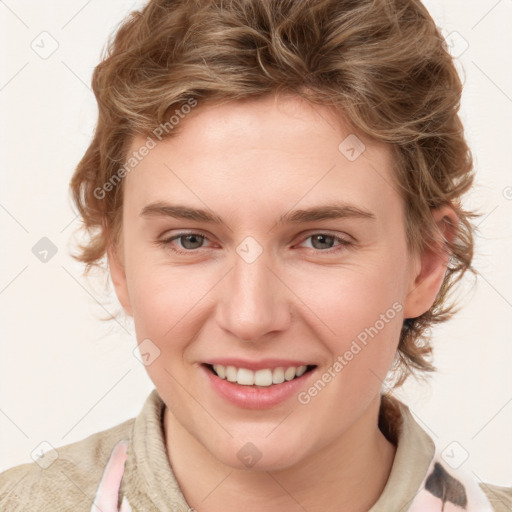 Joyful white young-adult female with medium  brown hair and blue eyes