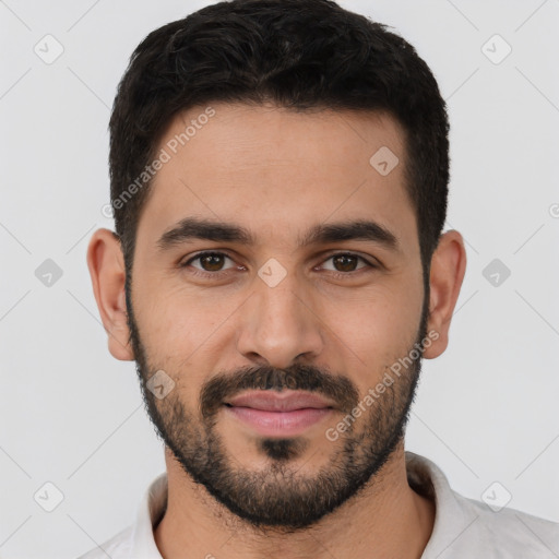 Joyful white young-adult male with short  black hair and brown eyes