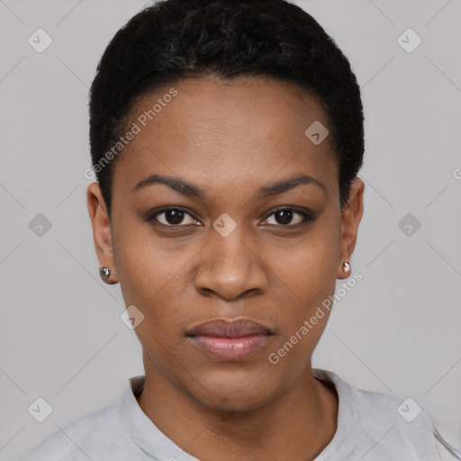 Joyful black young-adult female with short  black hair and brown eyes