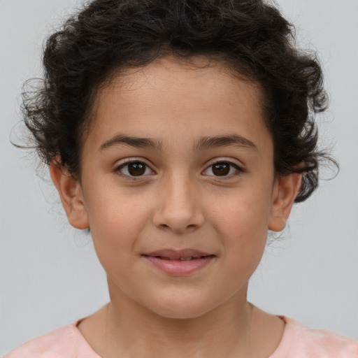 Joyful white child female with short  brown hair and brown eyes