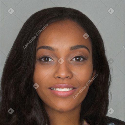 Joyful black young-adult female with long  black hair and brown eyes